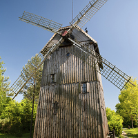 Buy canvas prints of Wooden old windmill house by Arletta Cwalina