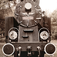 Buy canvas prints of Antique locomotive sepia toned by Arletta Cwalina