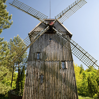 Buy canvas prints of Wooden windmill Kozlak house by Arletta Cwalina