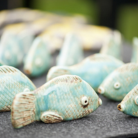 Buy canvas prints of Tiny fish ceramic decorations by Arletta Cwalina