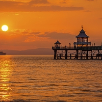 Buy canvas prints of Sun setting at Clevedon Pier. by Dean Merry