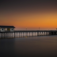 Buy canvas prints of  Sunrise glow at Penarth Pier by Dean Merry