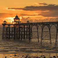 Buy canvas prints of Sun setting at Clevedon Pier by Dean Merry