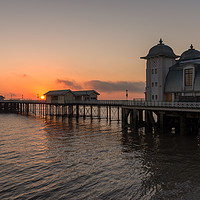 Buy canvas prints of Rising sun on Penarth Pier by Dean Merry