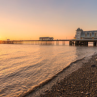 Buy canvas prints of Rising sun, Penarth Pier and coast by Dean Merry