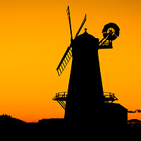 Buy canvas prints of Llancayo windmill silhouette  by Dean Merry