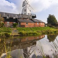 Buy canvas prints of  The white smock windmill situated on river Tillin by John Boud