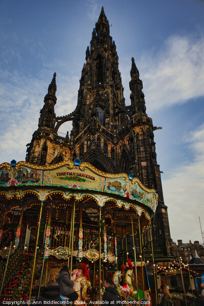 Scott monument with Carousel in Edinburgh  Picture Board by Ann Biddlecombe