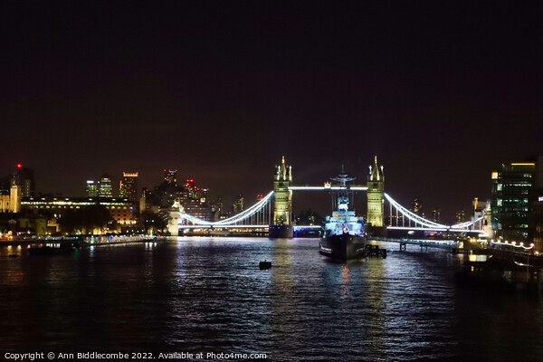 Tower bridge from London Bridge at night Picture Board by Ann Biddlecombe