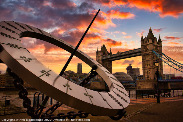 Sundial with tower bridge sunset skys in London Picture Board by Ann Biddlecombe