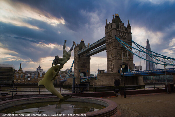 A statue in front of Tower Bridge Picture Board by Ann Biddlecombe