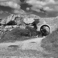 Buy canvas prints of Stone archway at Portland Quarry in black and white by Ann Biddlecombe