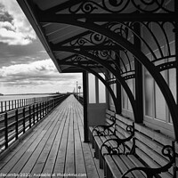 Buy canvas prints of Taking shelter on the pier in Southend on Sea by Ann Biddlecombe