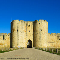 Buy canvas prints of Wall of the Medieval town of Aigues Mortes by Ann Biddlecombe