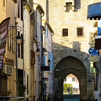 Buy canvas prints of A street inside the Fortress of Aigues Mortes by Ann Biddlecombe