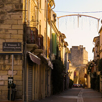 Buy canvas prints of A street inside Aigues Mortes by Ann Biddlecombe
