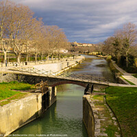 Buy canvas prints of Canal du Midi at Beziers looking down the old sect by Ann Biddlecombe