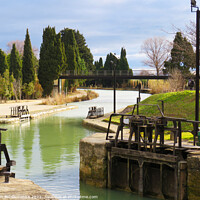 Buy canvas prints of Canal du Midi at Beziers looking down the canal  by Ann Biddlecombe