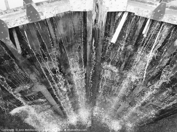 Water coming through the lock in black and white Picture Board by Ann Biddlecombe