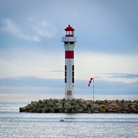 Buy canvas prints of Lighthouse at Cannes by Ann Biddlecombe