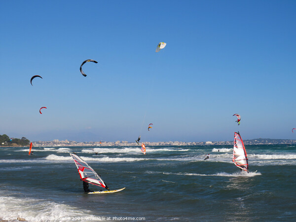 windsurfers and kite surfers on Palm beach Picture Board by Ann Biddlecombe