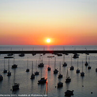Buy canvas prints of Sunrise over the outer harbor in Brixham  by Ann Biddlecombe