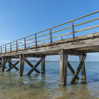 Buy canvas prints of Old wooden jetty by Paul Fleet