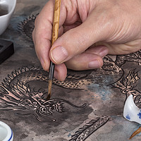 Buy canvas prints of Artist painting a Chinese dragon by Paul Fleet