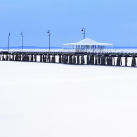 Buy canvas prints of Blue and White Pier by Peta Thames