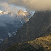Buy canvas prints of Golden Light catches the peak of Grandes Jorasses by Stephen Taylor