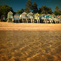 Buy canvas prints of Vintage Style Beach Hut View at Wells, Norfolk by Sally Lloyd