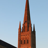 Buy canvas prints of Norwich Cathedral Spire  - Red Sunset by Sally Lloyd