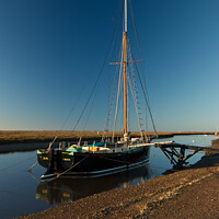 Buy canvas prints of The Juno in January at Blakeney Quay, Norfolk by Sally Lloyd