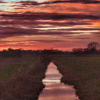 Buy canvas prints of Majestic Sunset Reflection over St Benets Abbey by Sally Lloyd