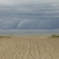Buy canvas prints of Storm clouds rolling at Great Yarmouth by Sally Lloyd