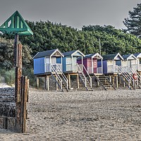 Buy canvas prints of Beach huts and marker at Wells next the Sea, Norfo by Sally Lloyd