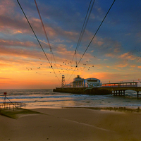 Buy canvas prints of  Sunrise at the pier. by paul cobb