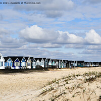 Buy canvas prints of A line of huts. by paul cobb