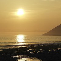 Buy canvas prints of Sunset over Manorbier Bay by Mandy Llewellyn