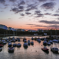 Buy canvas prints of The sun setting over Tenby Harbour  by Mandy Llewellyn