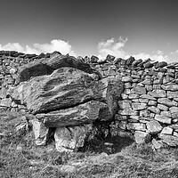 Buy canvas prints of Glacial erratic in a wall, photographed in monochrome by Mark Godden