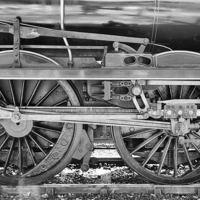 Buy canvas prints of  Train Wheels in monochrome. by Mark Godden