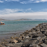 Buy canvas prints of A rock-armour breakwater at Lyme Regis on Dorset's by Mark Godden