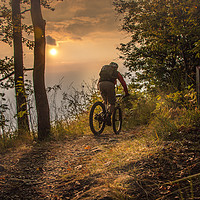 Buy canvas prints of Mountain biking till the sunset by Fabrizio Malisan