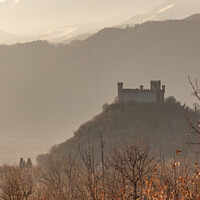 Buy canvas prints of The Castle on the hill winter sunset Montalto Dora in Piedmont Italy by Fabrizio Malisan