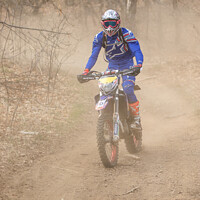 Buy canvas prints of Enduro Motocross Dust In The Woods by Fabrizio Malisan