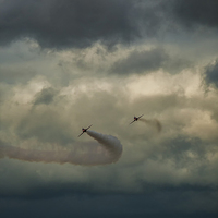 Buy canvas prints of  Red arrows with brooding skies by David Hirst