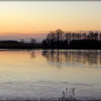Buy canvas prints of "Sunset across the frozen lake"  by ROS RIDLEY