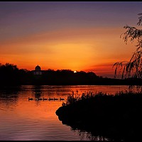 Buy canvas prints of "Sundown across the park lake" by ROS RIDLEY