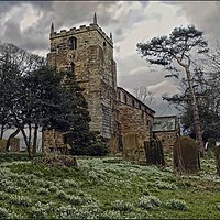Buy canvas prints of "Snow drops and storm clouds at St.Laurences Churc by ROS RIDLEY